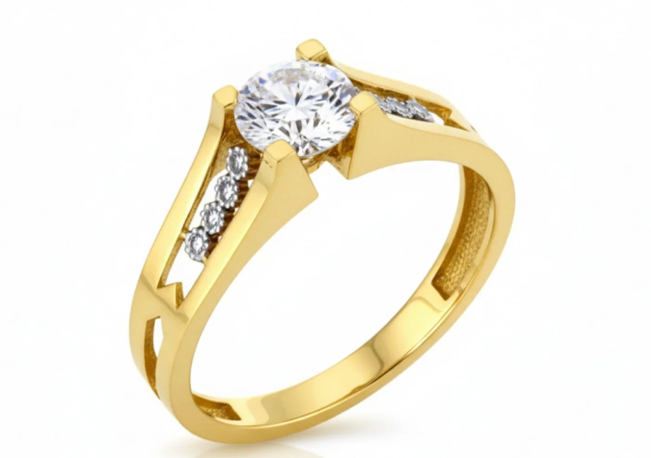 Elegantný zásnubný prsteň zo žltého zlata s centrálnym zirkónom a jemnou líniou bočných zirkónov v modernom, architektonickom dizajne.